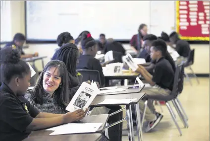  ?? YALONDA M. JAMES/THE COMMERCIAL APPEAL ?? Tennessee Education Commission­er Candice McQueen talks with Lester Prep six th-grader LaKenya Fields, 11, during a visit to the ASD school Wednesday. McQueen also stopped at Liber ta s School, also in the ASD, a s calls are growing locally and in Nashville to slow or abolish the ASD.