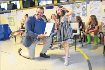  ?? TINA COMEAU ?? Grade 1 student Emma Perkins was all smiles as she and other Yarmouth Central Students received the Lieutenant Governor’s Respectful Citizenshi­p Award on June 22.