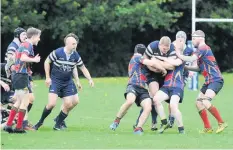  ??  ?? Action stations Livingston RFC take on their Broughton rivals