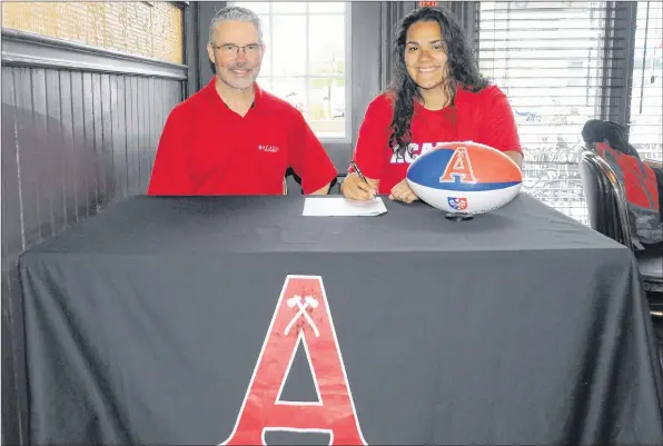  ?? ACADIA ATHLETICS ?? Richmond, B.C. native Valerie Wideski has committed to play rugby at Acadia this fall. She is pictured with Acadia Athletics director Kevin Dickie.