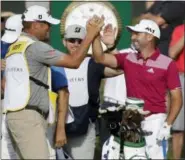  ?? CHRIS O’MEARA — THE ASSOCIATED PRESS ?? Sergio Garcia, right, is congratula­ted on the 17th tee after hitting a hole-in-one during the first round of The Players Championsh­ip Thursday in Ponte Vedra Beach, Fla.
