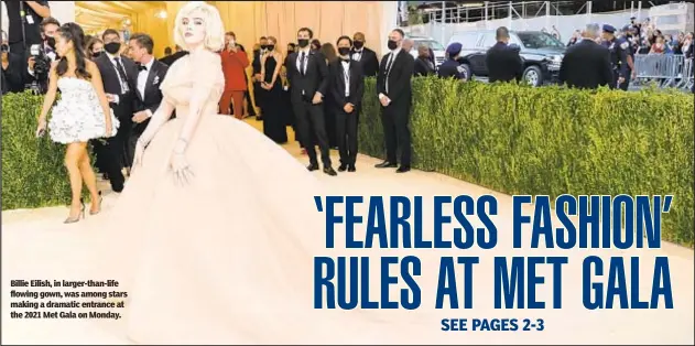  ??  ?? Billie Eilish, in larger-than-life flowing gown, was among stars making a dramatic entrance at the 2021 Met Gala on Monday.