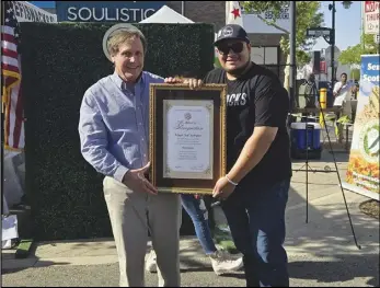  ?? PHOTO COURTESY OF STATE SEN. SCOTT WILK’S OFFICE ?? State Sen. Scott Wilk presents Refugio Rodriguez, founder of Antelope Valley-based RefiSnacks, with a certificat­e of recognitio­n as Senate District 21’s Small Business of the Month.