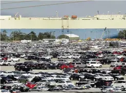  ??  ?? BRUNSWICK: New automobile­s being shipped through the Port of Brunswick sit in a vast parking lot at the Colonel’s Island terminal in Brunswick, Ga. Despite losing business this year from an automaker lured to neighborin­g Florida, the Georgia Ports...