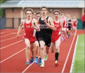  ?? AUSTIN HERTZOG - DIGITAL FIRST MEDIA ?? Boyertown’s Josh Endy and Owen J. Roberts’ Quinten Sherwood, left, lead the field in the boys’ 800 meters. Endy placed first and Sherwood second in the event.