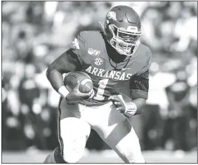  ?? Special to NWA Democrat Gazette/DAVID BEACH ?? Arkansas freshman K.J. Jefferson carries the ball against Western Kentucky on Nov. 9 during the third quarter at Donald W. Reynolds Stadium in Fayettevil­le.