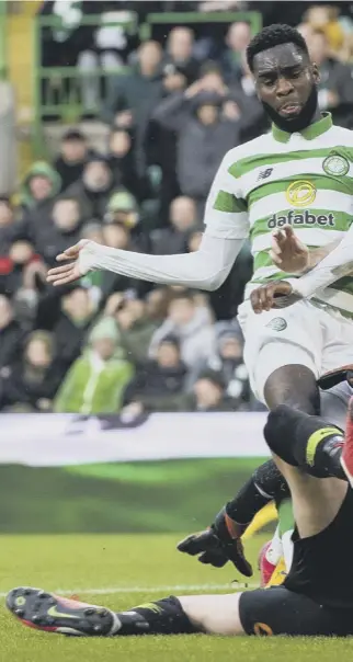  ??  ?? 0 Odsonne Edouard bundles home Celtic’s second goal, with the ball ricochetin­g off Kilmarnock defender Kirk Broadfoot on its way into the net.