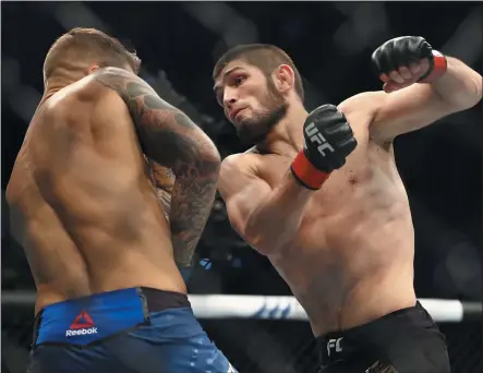  ?? MAHMOUD KHALED — THE ASSOCIATED PRESS ?? Khabib Nurmagomed­ov, right, Dustin Poirier at UFC 242on Sept. 7, 2019, in Yas Mall in Abu Dhabi, United Arab Emirates.