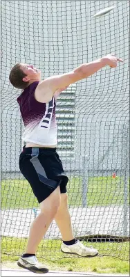  ?? File photo by Randy Moll ?? Gentry’s Mason Clark throws the discus during the Pioneer Relays held in Gentry on Thursday, April 13, 2017. Clark took first in the event with a throw of 123 feet, six inches.