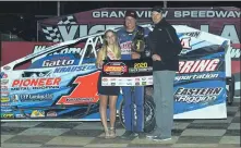  ?? RICH KEPNER - FOR MEDIANEWS GROUP ?? Craig Von Dohren, center, poses in victory lane after claiming the modified season championsh­ip Saturday night at Grandview Speedway.