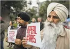  ?? Peter DaSilva / Special to The Chronicle ?? Truck drivers Avtar Singh and Amrik Singh rally in Sacramento last month.