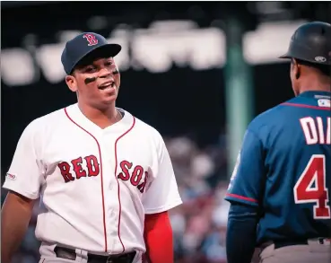  ?? File photo ?? Fans may get to see Red Sox third baseman Rafael Devers, above, and the rest of MLB’s stars on July 4 weekend after the owners proposed an 82-game season where the designated hitter would be used in all games.