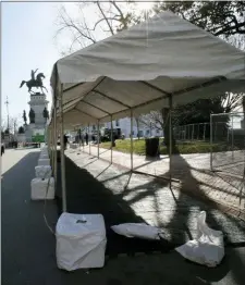  ?? BOB BROWN — RICHMOND TIMES-DISPATCH VIA AP ?? A tent is set up to house metal detectors at the entrance to Capitol Square in Richmond, Va., Friday. Everyone entering the Square on Monday, Jan. 20 for the pro-gun rally must pass through this point.