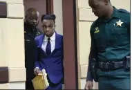  ?? (AP/South Florida Sun-Sentinel/Mike Stocker) ?? Jamell Demons, also known as rapper YNW Melly, enters the courtroom for a question from the jury as they deliberate on Saturday at the Broward County Courthouse in Fort Lauderdale, Fla.