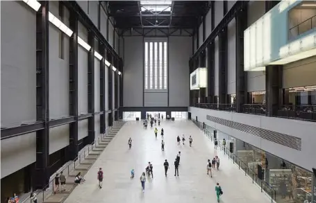  ??  ?? The Turbine Hall at the Tate Modern in London. As luxury condos proliferat­e across London, the evolving Tate Modern provides a model for the city’s public spaces.