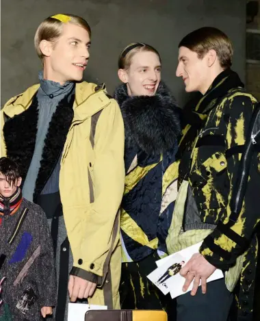  ??  ?? Clockwise from above: backstage at Dries Van Noten; portfolio by Tod’s; sneaker by Balenciaga; backpack by Lanvin; a look at Raf Simons