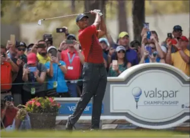  ?? MIKE CARLSON — THE ASSOCIATED PRESS ?? Tiger Woods hits from the second tee during the final round of the Valspar Championsh­ip golf tournament Sunday in Palm Harbor, Fla.