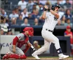  ?? ELSA – GETTY IMAGES ?? Matt Carpenter of the Yankees watches his two-run homer clear the wall during the first inning of Tuesday night's game against the Angels at Yankee Stadium.