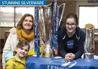  ??  ?? Ciara Gavaghan, Joan Mooty and Deirbhile Gavaghan with the European Rugby Champions Cup and Guinness Pro 14 at the Towns Cup celebratio­n at Arklow Rugby Club.