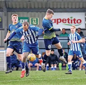  ?? Picture: Haydn Jones ?? Clevedon Town’s Oli Babington, second left, battles for the ball with Shepton Mallet’s Jacob Sloggett during a Toolstatio­n League Premier Division game at the Everyone Active Stadium last month