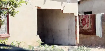  ??  ?? The Nkulumane house with a huge hole in one of the walls caused by Constable Munyaradzi Mupfawa