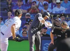  ?? Jae C. Hong Associated Press ?? SHOHEI OHTANI of the AL team leads off the game with a single against NL starting pitcher Clayton Kershaw. Ohtani had promised: “First pitch, first swing.”