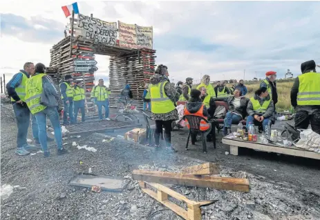  ?? /AFP ?? Fuelling anger: Demonstrat­ors block the road leading to the Frontignan oil depot in the south of France, as they demonstrat­e against the rise in fuel prices and the cost of living. Dozens also blocked access to several highways in the third week of anti-government protests.