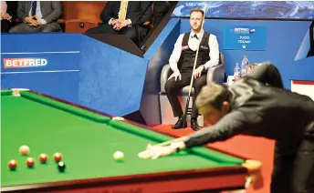  ?? — AFP photo ?? Trump sits in his chair watching O’Sullivan play during the final.