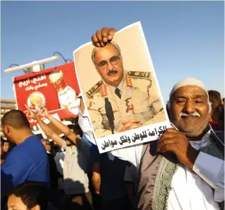  ??  ?? Gen. Khalifa Haftar’s supporters see him as a force of stability that can re-unite Libya. (AFP)