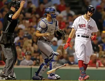  ?? STUART CAHILL / BOSTON HERALD ?? GETTING OUT OF HAND: Andrew Benintendi reacts after getting called out on strikes to end the fourth inning in the Red Sox’ 11-2 loss to the Dodgers last night.