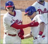  ?? LAURENCE KESTERSTON – THE ASSOCIATED PRESS ?? Phillies third baseman Alec Bohm, left, is congratula­ted by J.T. Realmuto after he hit a home run in the first inning Wednesday at Citizens Bank Park.