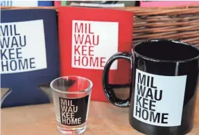  ?? ANGELA PETERSON / MILWAUKEE JOURNAL SENTINEL ?? MilwaukeeH­ome products include shot glasses, coffee mugs and can coozies.