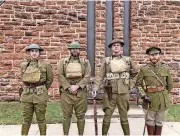  ?? MEDLEY, THE OKLAHOMAN] [PHOTO BY ROBERT ?? Portraying American doughboys of World War I are, from left to right, Jason Nadle, 27, of Shawnee, Christian Rountree, 31, of Oklahoma City, and Mike Buckendorf, 50, of Tulsa. On the right of the Yanks is T.S. Akers, 33, of Oklahoma City, who wore the uniform of a British officer. The men were at the 45th Infantry Division Museum’s Veterans Day ceremony Sunday in Oklahoma City.