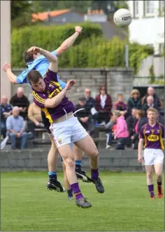  ??  ?? Mikie Dwyer and Dublin’s Brian Howard contesting this high ball.