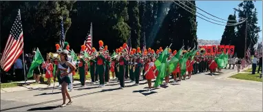  ?? RECORDER PHOTOS BY CHARLES WHISNAND ?? The Portervill­e High Panther Band dressed in uniform play during the Parading the Avenue of Flags at Monday’s Memorial Day Observance at Hillcrest Cemetery.