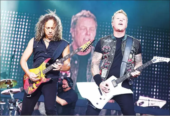  ??  ?? This file photo taken on June 8, 2013 shows Kirk Hammett and James Hetfield of Metallica as they perform during the 2013 Orion Music + More Festival at Belle Isle Park in Detroit, Michigan. Heavy metal greats Metallica and pop superstar Rihanna will...