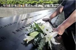  ??  ?? Left, Tobin and Royster. Above, Giebfried honors colleagues who died giving emergency medical care. “The women first responders of 9/11 are often forgotten,” says firefighte­r Wilson. “But bravery doesn’t
have a gender or a race.”