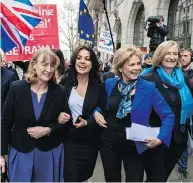  ?? CHRIS J RATCLIFFE/GETTY IMAGES ?? Former Labour MP Joan Ryan, left, links arms with former Tory MPS Heidi Allen, Anna Soubry and Sarah Wollaston after their resignatio­ns on Wednesday.