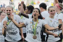  ?? ASSOCIATED PRESS FILE PHOTO ?? Canada's Desiree Scott, centre, and her teammates celebrate after winning bronze in an Olympic tournament in Brazil in 2016.