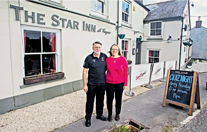  ?? ?? Mark and Rachel Graham outside their pub, the Star Inn at Vogue, in Cornwall. Vogue, the fashion magazine expressed concern that people might confuse the two and asked them to change the name of the 200-year-old pub