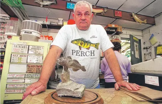  ?? SUN-TIMES LIBRARY ?? John E. “Jack” Vadas, a bait shop owner on Chicago’s East Side who fought to protect Lake Michigan and its perch and was hailed as a “major figure in Lake Michigan fisheries,” died at 86. He is seen here in 1999 at Vet’s Bait, 10150 S. Indianapol­is.