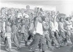  ?? AFP ?? Red Guards, high school and university students wave copies of Chairman Mao Zedong’s ‘Little Red Book’ as they parade in Beijing in June 1966.