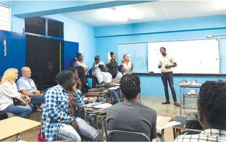  ?? Al Merritt/Miami Herald/TNS ?? ■ The Portland Arts and Vocational Education Centre provides training, mentoring and hands-on experience to at-risk youth in Jamaica. The venture was created by Miami businessma­n James “Al” Merritt and his wife, Patricia Chin Merritt.
