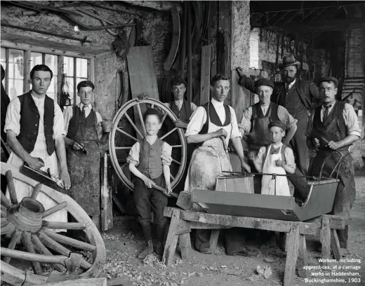  ??  ?? Workers, including apprentice­s, at a carriage works in Haddenham, Buckingham­shire, 1903