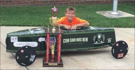  ?? SUBMITTED PHOTO ?? Nine-year-old Matthew Tomczak with his winning, camouflage-themed Stock car.