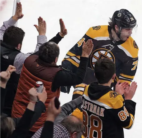  ?? MaTT sTone / HeraLd sTaFF FILe ?? ‘CREATE CHAOS’: Bruins forward Jake DeBrusk celebrates a goal against the Winnipeg Jets on Jan. 8 at TD Garden.