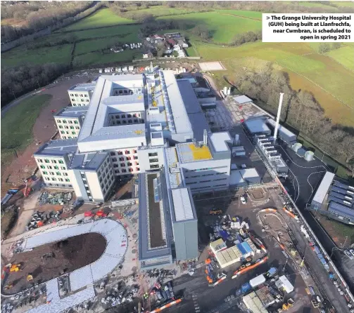  ??  ?? > The Grange University Hospital (GUH) being built at Llanfrechf­a, near Cwmbran, is scheduled to open in spring 2021