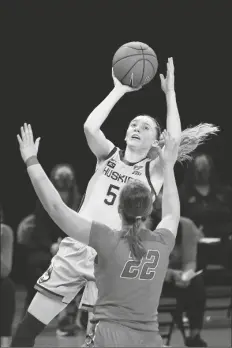  ?? ASSOCIATED PRESS ?? CONNECTICU­T’S PAIGE BUECKERS (5) shoots over DePaul’s Jorie Allen during the first half of a game on Sunday in Chicago.