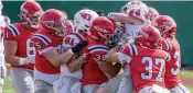  ?? ?? Senior safety Ca’ron Coleman (37) and Aiden McKinley (38) lead a gang tackling of Dominic Vrbancic. The defense dominated the game Sunday.