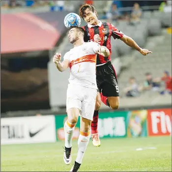  ??  ?? Kwak Tae-hwi (right), of South Korea’s FC Seoul heads the ball with Graziano Pelle of China’s Shandong Luneng FC during their AFC Champions League quarterfin­al at Seoul World Cup Stadium in Seoul, South Korea on Aug 24. FC Seoul
defeated Shandong...